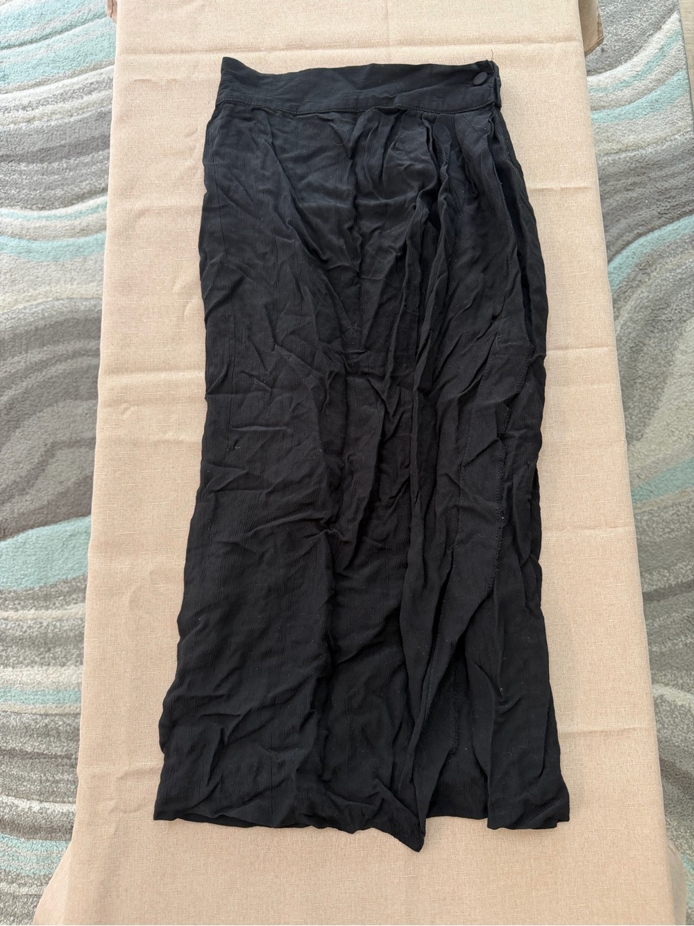 Black Lightweight wrap around button skirt.